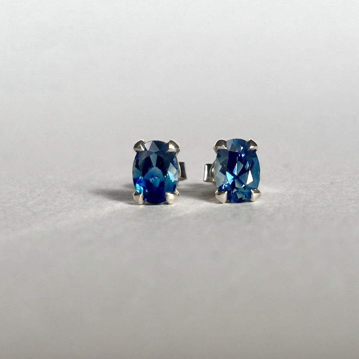 Oval Cut 7 x 5mm Australian Blue Sapphires in white gold settings 